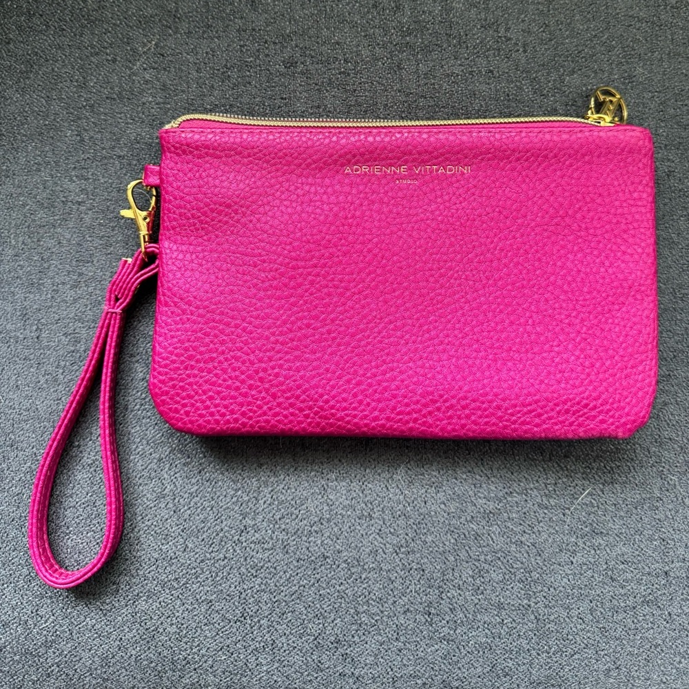 Adrienne vittadini pink clutch with charger.  Never been used.
